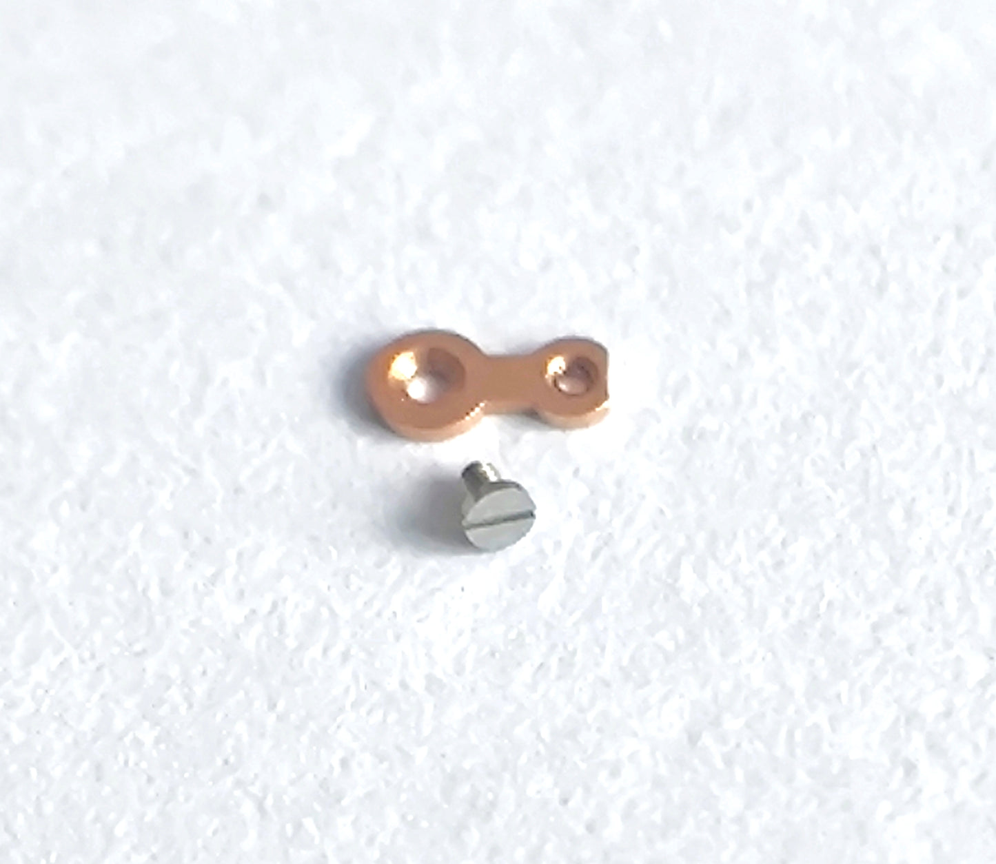 Omega caliber 550 bearing for ratchet wheel driving gear with screw detail