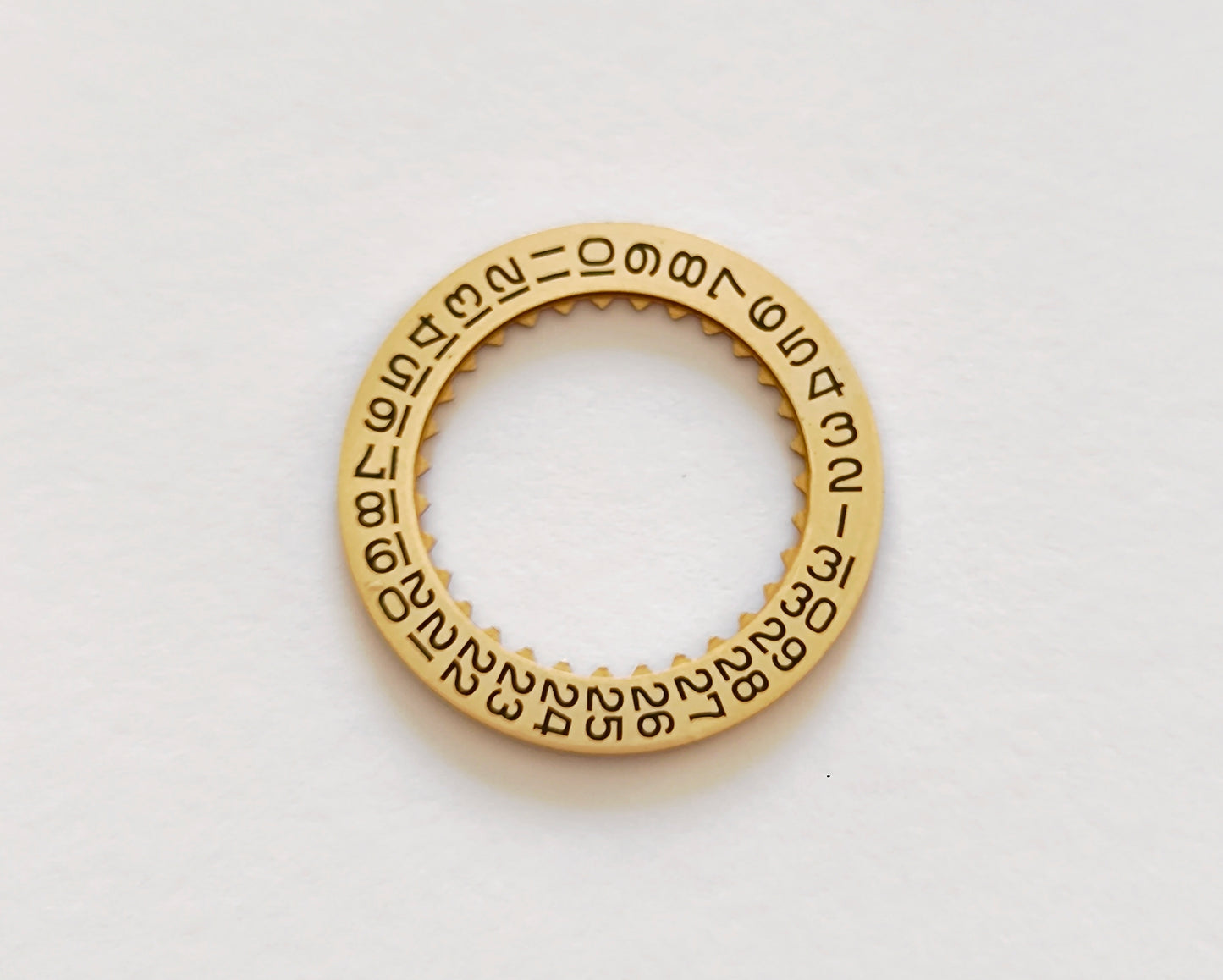 Certina KF 25-652 H3 date indicator disc gold champagne front view black numerals