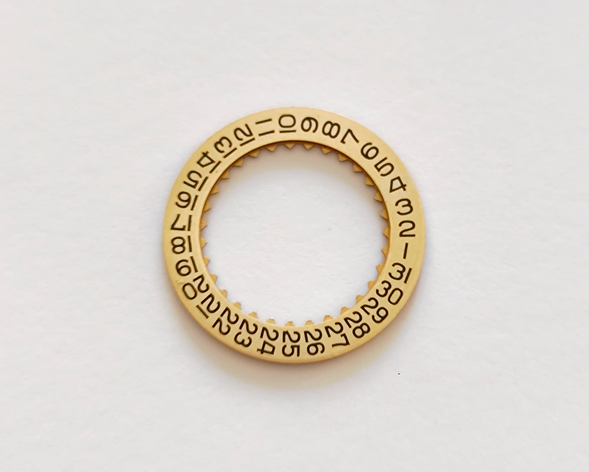 Certina KF 25-652 H3 date indicator disc gold champagne front view black numerals