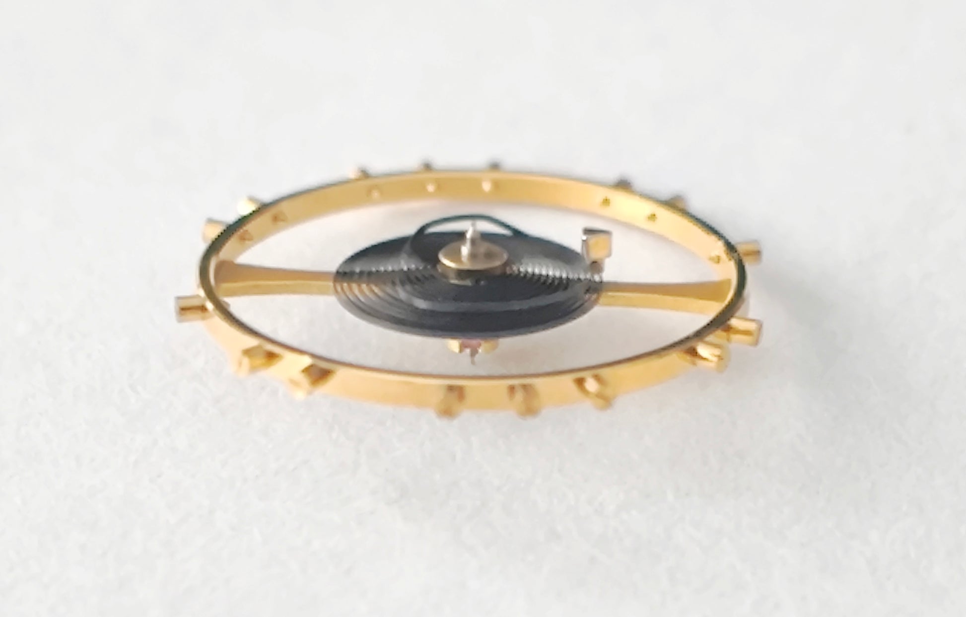 Omega balance complete gold tone with hairspring macro detail