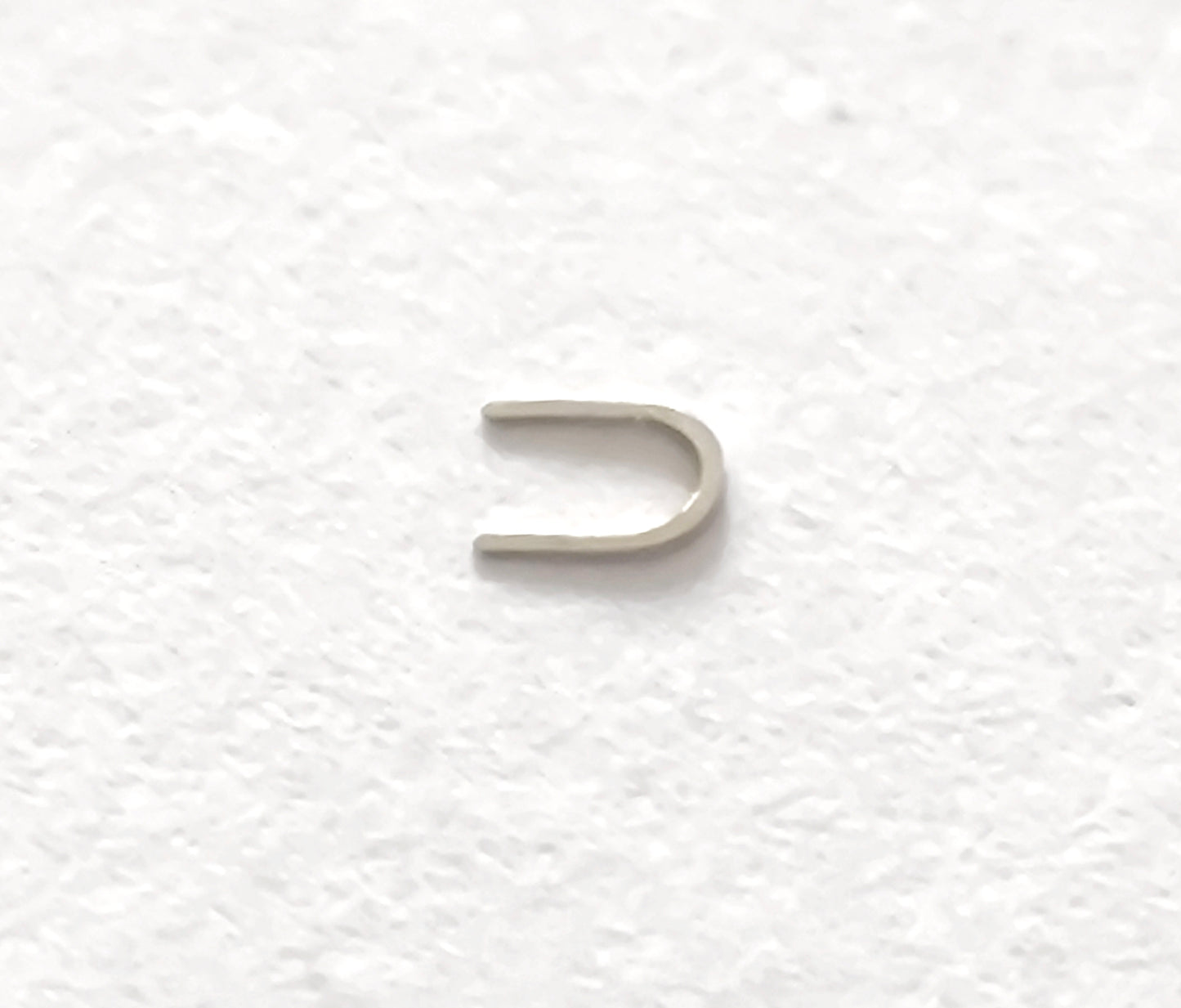 Omega 100-1345 Incabloc bolt upper original watch part side view detail