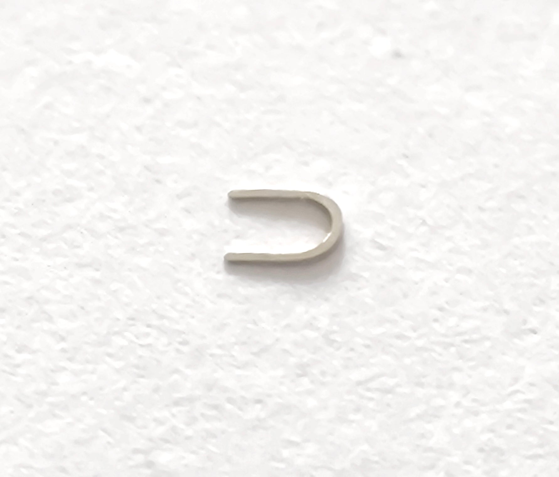 Omega 100-1345 Incabloc bolt upper original watch part side view detail