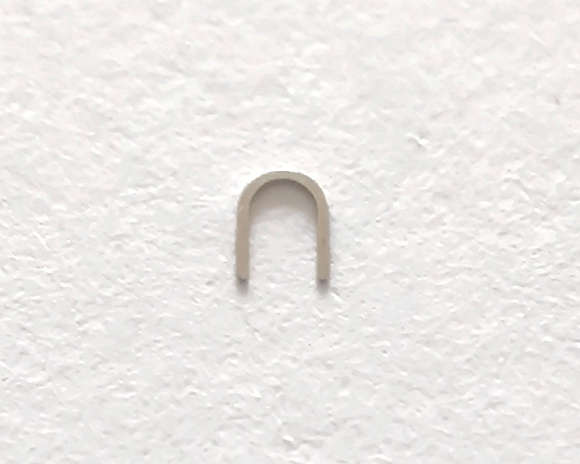 Omega 100-1345 Incabloc bolt upper original watch movement part close-up front view