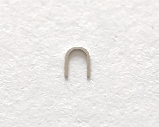 Omega 100-1345 Incabloc bolt upper original watch movement part close-up front view