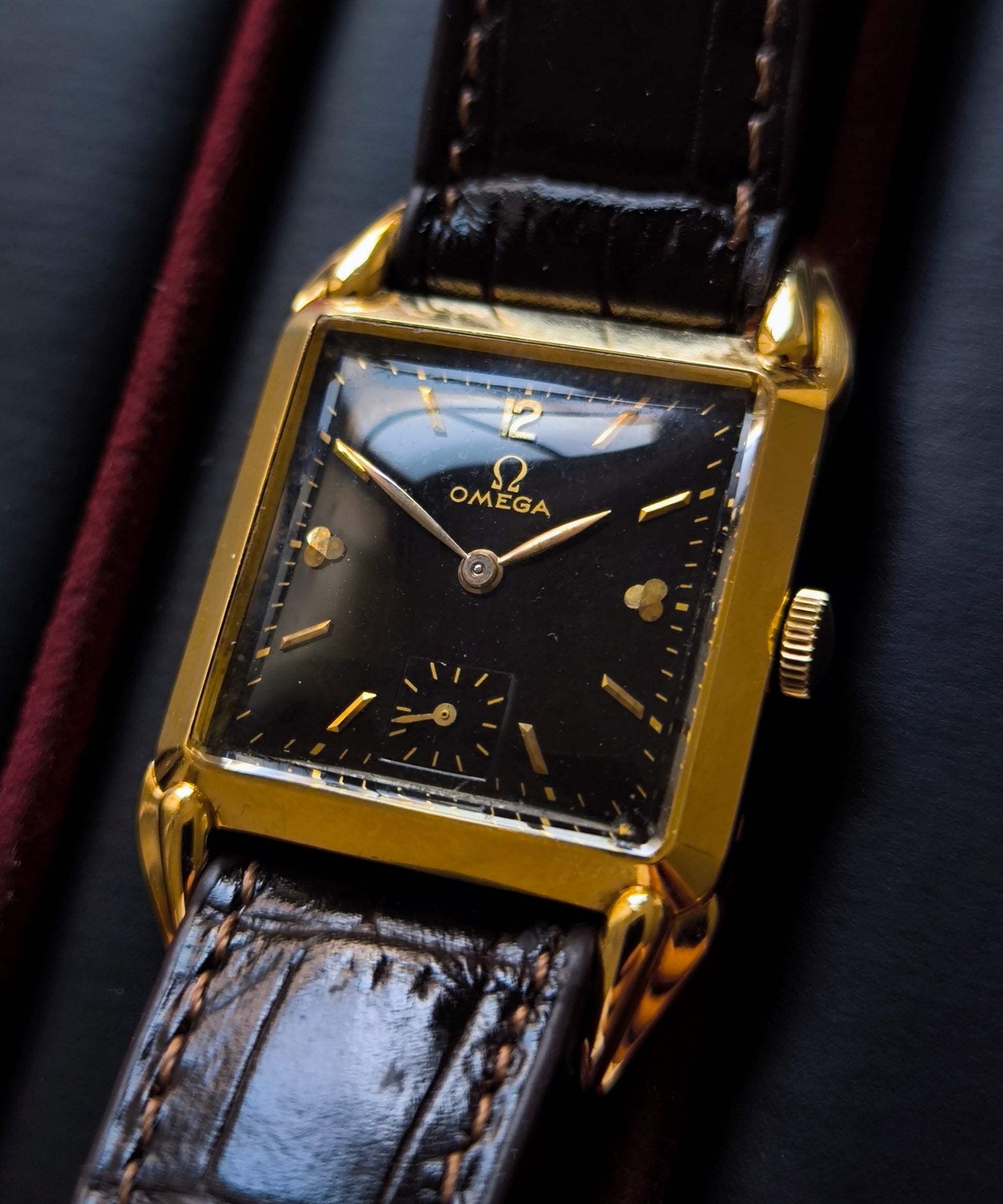 Vintage Omega Art Deco Tank 18K solid gold watch with black dial and fancy lugs