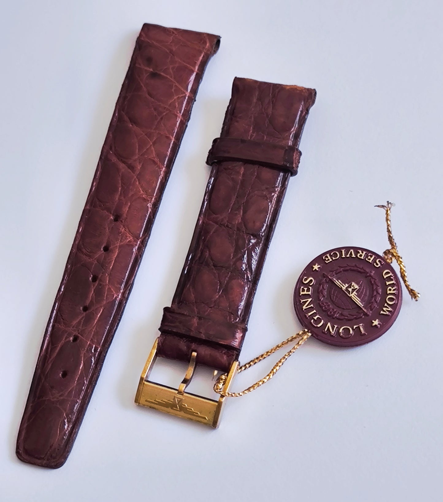Vintage Longines 18mm leather watch strap and World Service tag