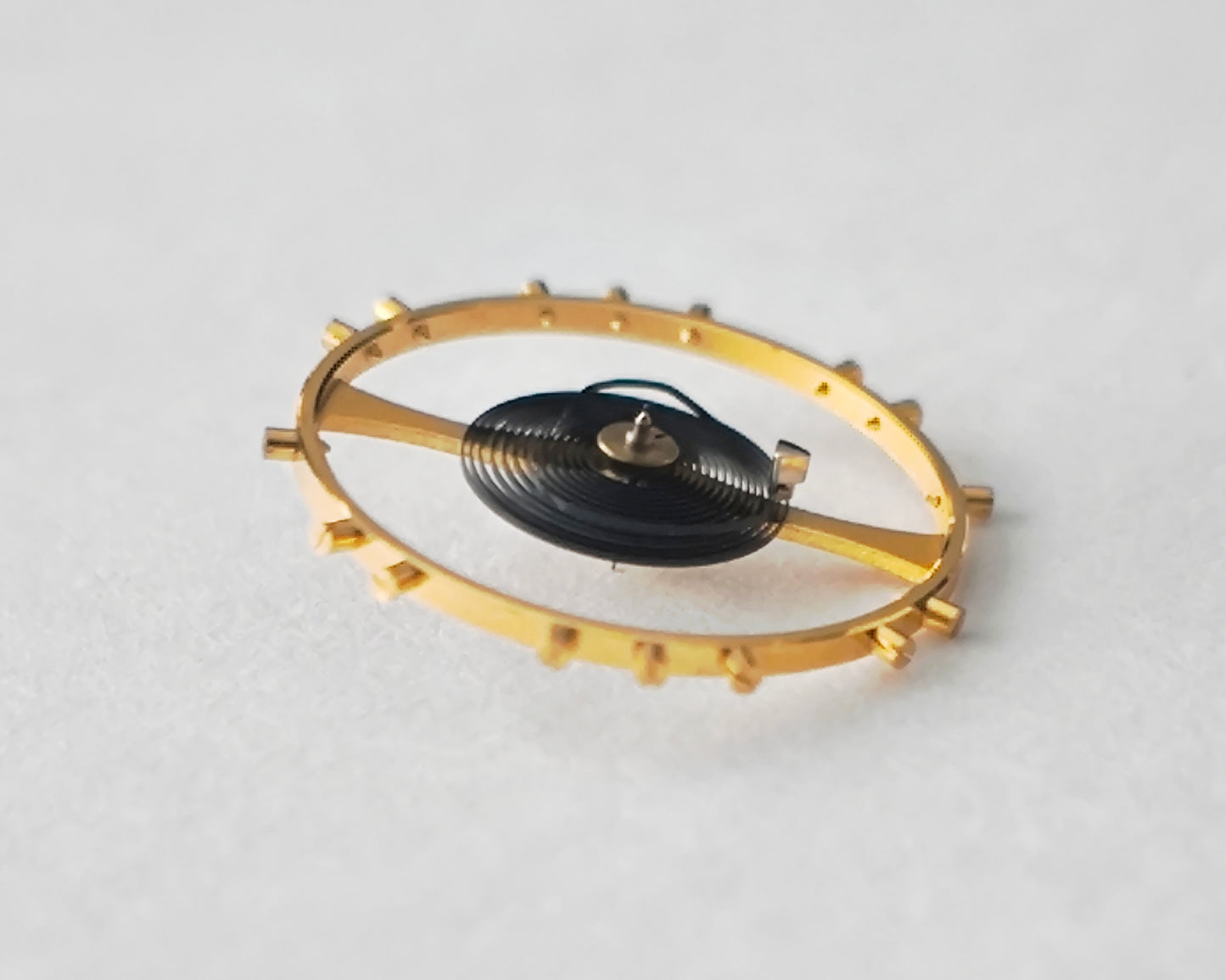 Omega balance complete gold tone with hairspring macro detail